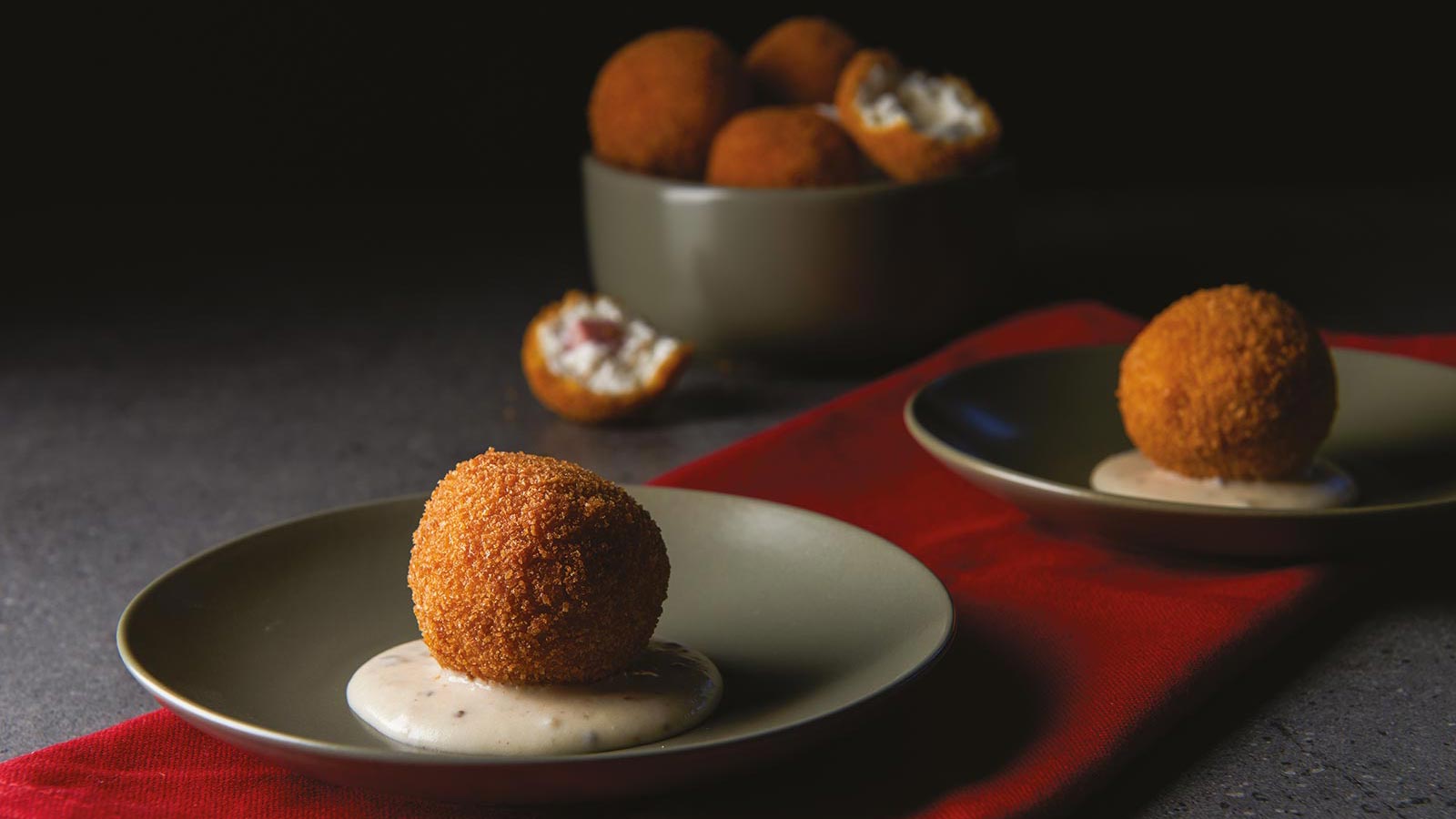 Mortadella And Ricotta Croquette On Cheese And White Truffle Cream